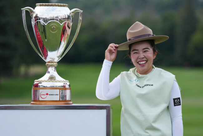 miyu-yamashita-of-japan-tries-on-a-royal-canadian-mounted-police-officers-stetson-as-she-poses-with-the-trophy-after-winning-the-lpga-canadian-womens-open-golf-tournament-in-edmonton-alberta-sun