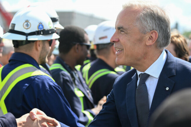canadian-prime-minister-mark-carney-meets-with-workers-at-the-davie-shipyard-in-levis-quebec-on-monday-aug-24-2026-jacques-boissinotthe-canadian-press-via-ap