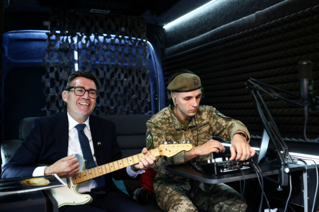 britains-prime-minister-andy-burnham-plays-the-guitar-in-the-mobile-recording-studio-of-the-military-and-artistic-unit-who-perform-on-the-front-lines-in-hospitals-and-at-rehabilitation-centres-cul