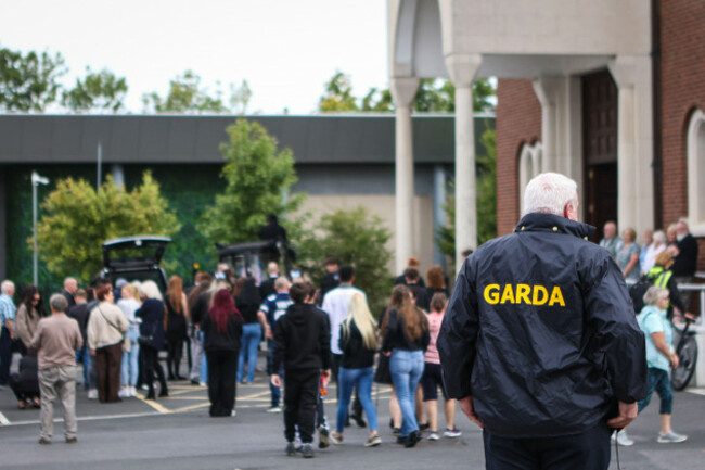 a-garda-officer-looks-on-as-mourners-arrive-for-the-funeral-of-jack-kennedy-at-st-michaels-parish-church-in-athy-co-kildare-jack-was-one-of-the-five-teenagers-who-died-in-a-motorway-crash-in-co-ki