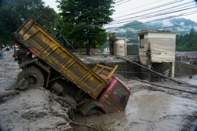 a-vehicle-is-seen-in-the-aftermath-of-a-flash-floods-in-devighat-in-the-nuwakot-district-in-nepal-thursday-aug-27-2026-ap-photoniranjan-shrestha