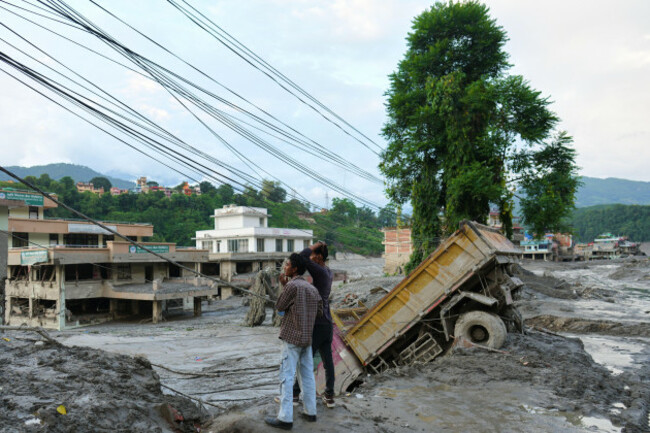 residents-look-at-the-devastation-left-by-flash-flooding-in-nepals-nuwakot-district-thursday-aug-27-2026-ap-photorajesh-kumar-singh
