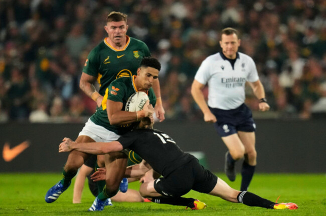 south-africas-sacha-feinberg-mngomezulu-left-is-tackled-by-new-zealands-damian-mckenzie-during-a-test-rugby-match-between-south-africa-and-new-zealand-in-johannesburg-south-africa-saturday-aug