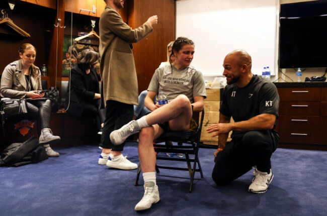 katie-taylor-speaks-with-her-coach-ross-enamait-in-the-changing-room-after-the-fight