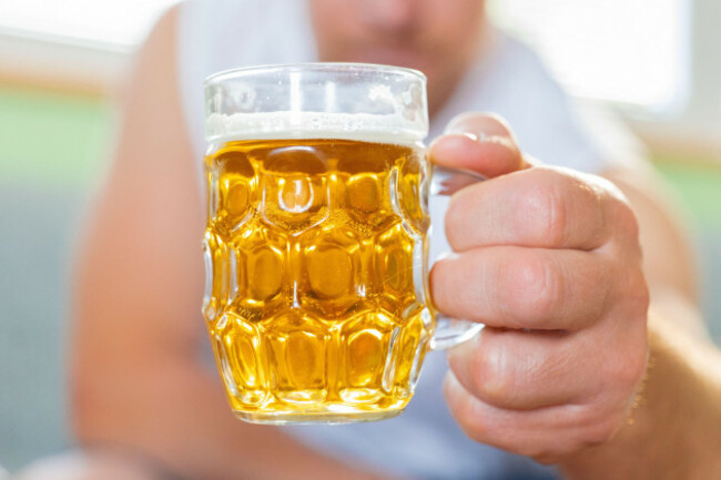 a-person-holding-a-beer-mug-the-process-of-consuming-alcoholic-beverages-traditional-drink-in-germany