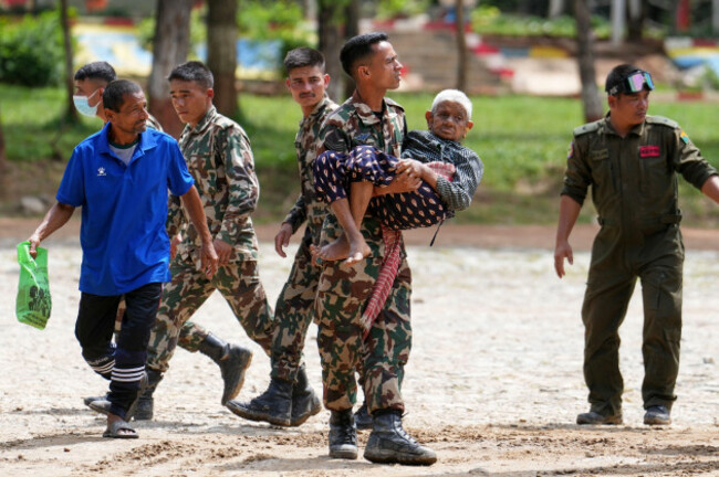 a-soldier-carries-an-elderly-woman-rescued-by-a-helicopter-from-a-flood-affected-area-at-an-army-camp-in-trishuli-nuwakot-district-sunday-aug-30-2026-ap-photorajesh-kumar-singh
