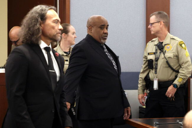 duane-davis-center-and-his-attorney-michael-sanft-are-led-back-to-a-courtroom-to-hear-his-sentencing-date-after-a-jury-found-davis-guilty-of-first-degree-murder-in-his-trial-related-to-the-1996-kill
