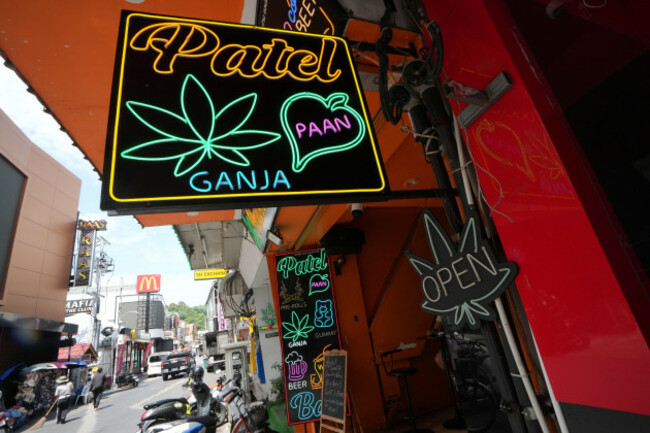 workers-clean-a-road-next-to-a-sign-of-a-cannabis-shop-in-pattaya-thailand-tuesday-sept-1-2026-ap-photosakchai-lalit