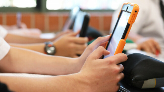 high-school-students-working-on-using-an-ipad-tablet-style-electronic-computer-device-modern-pedagogy-and-teaching-learning-in-education-educational