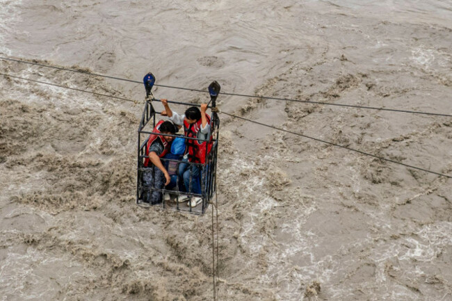 residents-commute-across-the-trishuli-river-on-a-newly-installed-zipline-in-the-aftermath-of-flash-floods-at-bidur-in-nepals-nuwakot-district-thursday-sept-3-2026-ap-photorajesh-kumar-singh