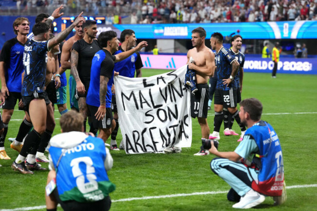 argentina-players-hold-up-a-banner-with-the-words-las-malvinas-son-argentinas-which-translates-to-the-malvinas-are-argentine-following-victory-in-the-fifa-world-cup-2026-semi-final-match-at-the-at