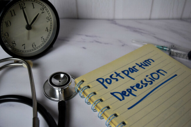 postpartum-depression-write-on-a-book-and-keyword-isolated-on-office-desk-healthcaremedical-concept