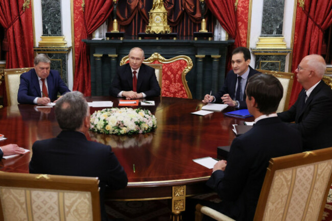 president-vladimir-putin-background-center-attends-talks-with-u-s-president-donald-trumps-envoys-steve-witkoff-foreground-left-back-to-camera-and-jared-kushner-foreground-right-back-to-camera
