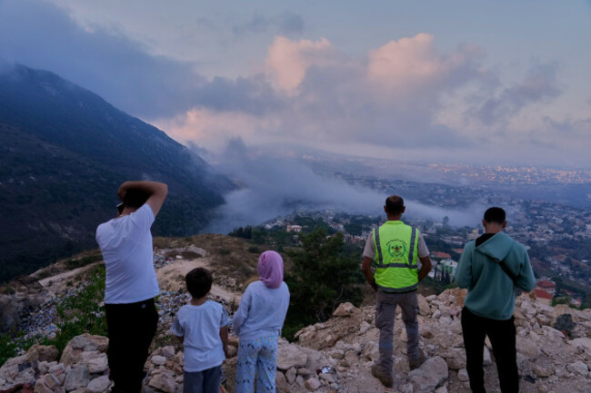 people-watch-a-smoke-rise-from-an-israeli-airstrike-that-hit-a-house-in-arab-salim-village-southern-lebanon-sunday-sept-6-2026-ap-photomohammed-zaatari-correction-corrects-village-name-to-ar