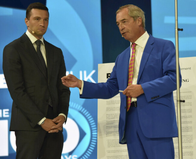 nigel-farage-leader-of-the-british-reform-uk-and-jordan-bardella-president-of-frances-rassemblement-nationalrn-attend-the-reform-uk-party-conference-in-birmingham-united-kingdom-on-september