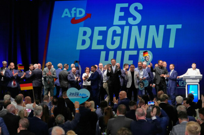 afd-party-members-celebrate-in-front-of-a-reading-it-starts-here-after-the-first-results-at-an-election-party-of-the-alternative-for-germany-afd-after-the-saxony-anhalt-state-elections-in-magdeb