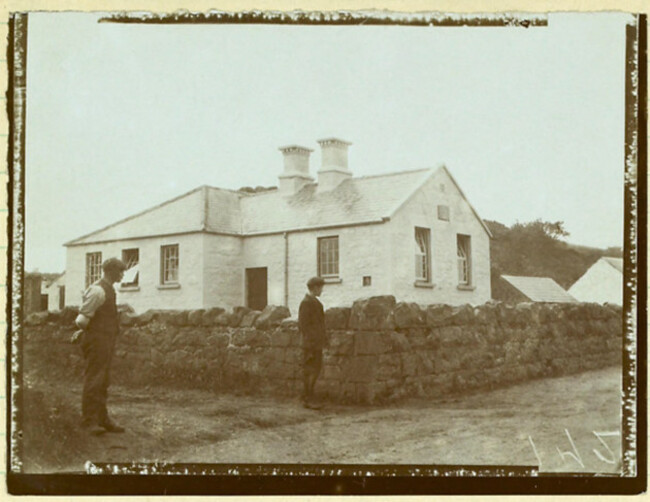 a-photograph-of-craigs-school-in-county-antrim-northern-ireland-depicting-the-exterior-of-the-building-and-surrounding-landscape-providing-a-glimpse-into-the-local-education-environment-during-the