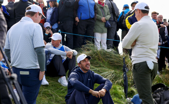 robert-macintyre-brooks-koepka-and-rory-mcilroy-wait-on-the-fourth-tee-box-for-the-fairway-to-clear