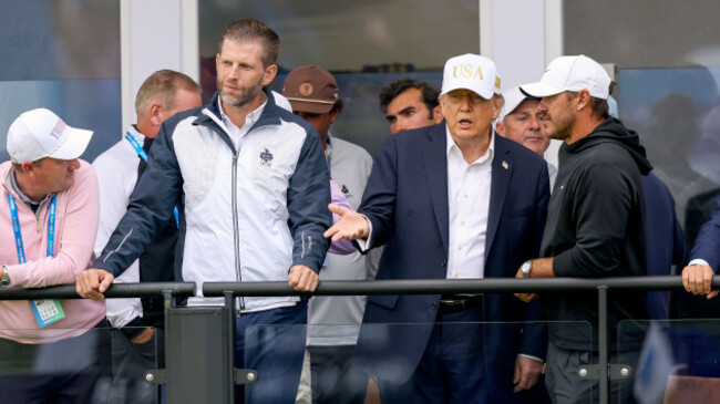 donald-trump-and-his-son-eric-speak-with-brooks-koepka-while-watching-over-the-eighteenth-green