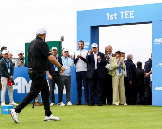 shane-lowry-walks-off-the-first-tee-as-he-is-acknowledge-by-donald-trump