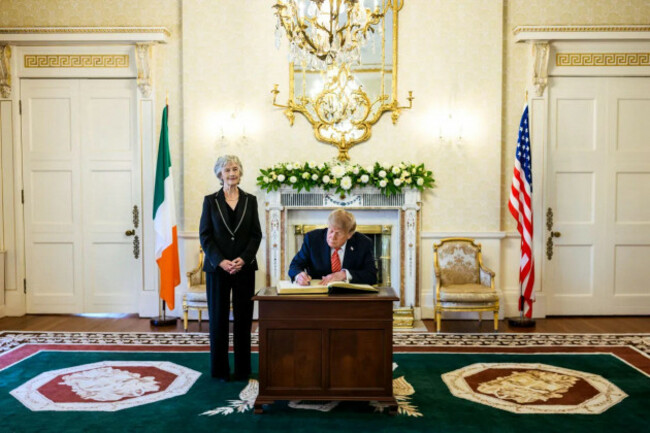 president-donald-j-trump-signs-the-distinguished-visitors-book-as-president-of-ireland-catherine-connolly-looks-on-at-aras-an-uachtarain-in-dublin-ireland-september-12-2026-the-signing-formed-par
