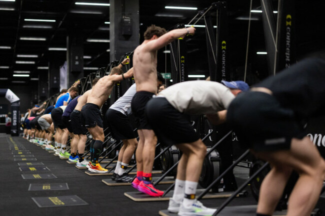 cologne-germany-16th-apr-2026-athletes-take-part-in-a-hyrox-competition-at-the-fibo-2026-fitness-trade-fair-at-koelnmesse-hyrox-is-an-indoor-fitness-competition-that-combines-eight-kilometers-of