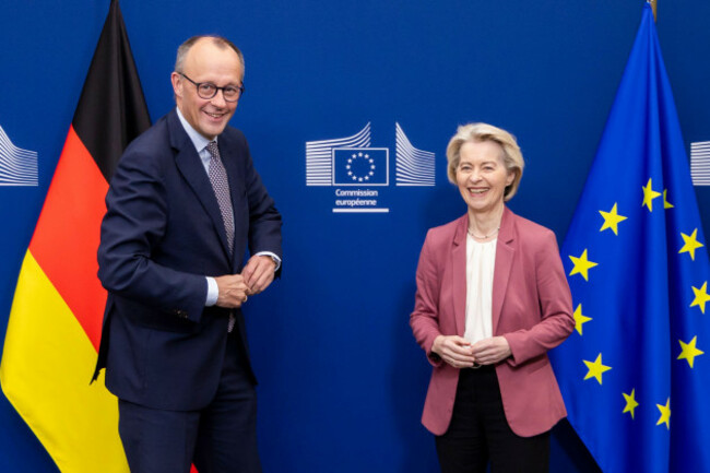 european-commission-president-ursula-von-der-leyen-right-welcomes-germanys-chancellor-friedrich-merz-at-eu-headquarters-in-brussels-friday-dec-5-2025-ap-photogeert-vanden-wijngaert