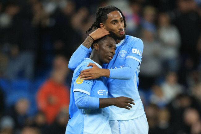 ryan-mcaidoo-of-manchester-city-and-kaden-braithwaite-of-manchester-city-celebrate-5th-goal-during-the-carabao-cup-third-round-match-between-manchester-city-and-norwich-city-at-etihad-stadium-on-septe
