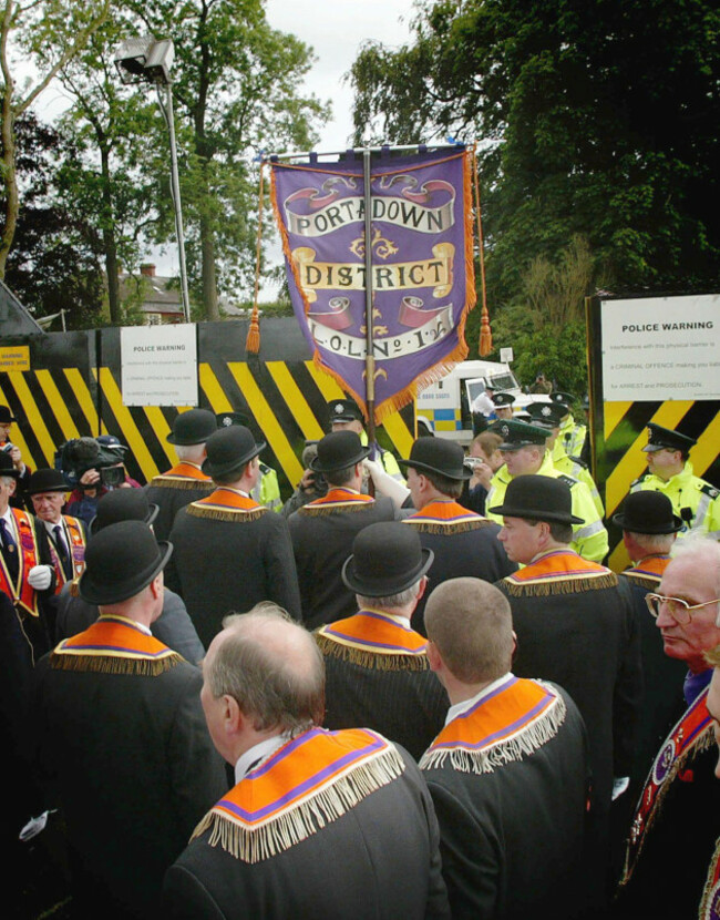 portadown-orangemen-march-down-from-drumcree-church-to-a-security-barrier-at-drumcree-portadown-northern-ireland-sunday-july-4-2004-the-controversial-parade-was-again-barred-from-marching-down-t