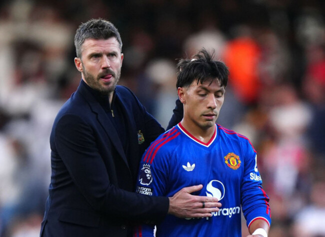 manchester-united-manager-michael-carrick-with-lisandro-martinez-following-the-premier-league-match-at-craven-cottage-london-picture-date-sunday-september-20-2026
