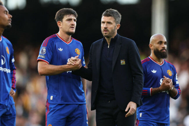harry-maguire-of-manchester-united-shakes-hands-with-michael-carrick-manager-of-manchester-united-after-the-premier-league-match-between-fulham-and-manchester-united-at-craven-cottage-london-on-sund