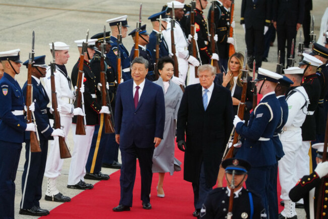 xi-jinping-chinas-president-from-left-peng-liyuan-chinas-first-lady-us-president-donald-trump-and-first-lady-melania-trump-during-an-arrival-ceremony-at-joint-base-andrews-maryland-us-on-we