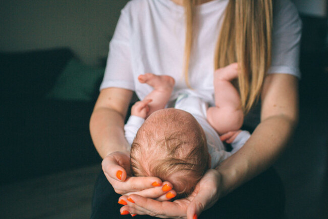 portrait-of-a-newborn-baby-mother-holds-a-child-in-her-arms-the-first-year-of-life-care-and-care