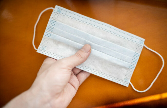 protective-medical-mask-in-hand-selective-focus