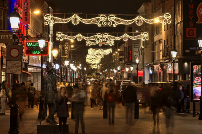 dublin-ireland-november-13-2021-beautiful-view-of-festive-christmas-lights-on-busy-henry-street-in-the-evening-during-the-covid-19-pandemic