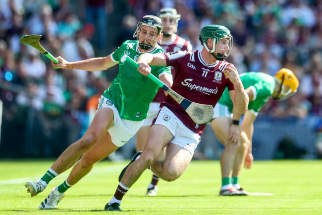 cathal-mannion-is-pursued-by-gearoid-hegarty