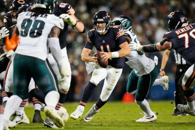 chicago-bears-quarterback-case-keenum-11-scrambles-as-philadelphia-eagles-jalen-carter-98-helps-defend-on-the-play-during-the-second-half-of-an-nfl-football-game-in-chicago-monday-sept-28-202
