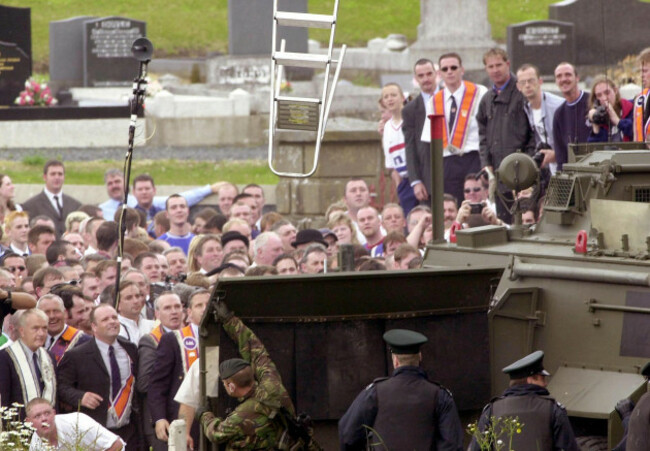 a-british-soldier-takes-cover-behind-barriers-as-orange-order-marchers-throw-ladders-and-stones-at-them-after-being-stopped-outside-drumcree-church-nationalist-residents-living-on-the-garvaghy-road