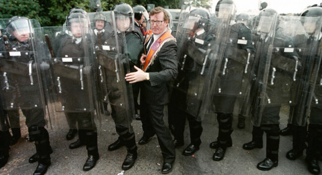 ulster-unionist-mp-david-trimble-squeezes-through-the-ruc-line-after-negotiations-with-senior-ruc-officiers-to-prevent-the-stand-off-at-drumcree-parish-church-after-the-ruc-prevent-the-orange-order-pa