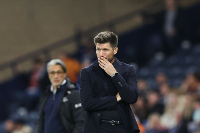 scotland-head-coach-sebastien-pocognoli-and-switzerland-head-coach-murat-yakin-left-stand-by-the-touchline-during-the-nations-league-soccer-match-between-scotland-and-switzerland-in-glasgow-scotlan