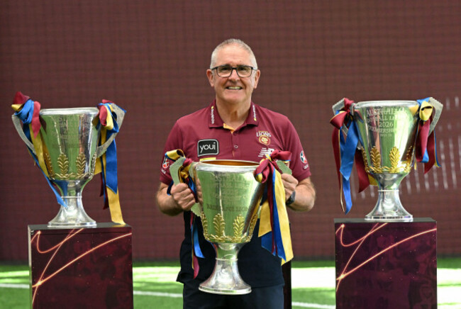 brisbane-australia-01st-oct-2026-lions-coach-chris-fagan-is-seen-holding-his-three-afl-premiership-trophies-after-a-brisbane-lions-afl-press-conference-in-brisbane-thursday-october-1-2026-chri