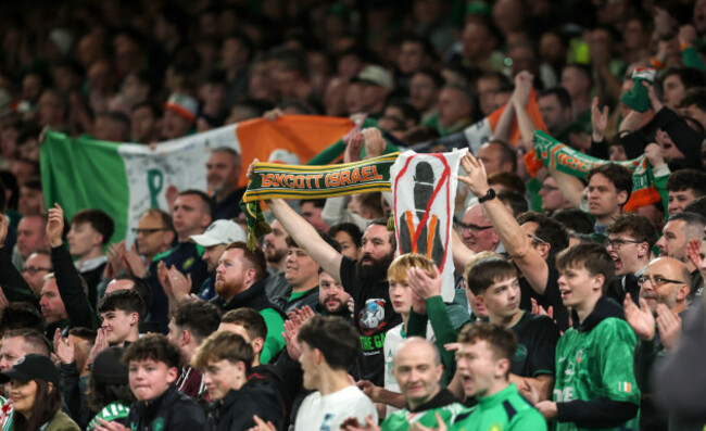 a-fan-displays-a-scarf-that-reads-boycott-israel