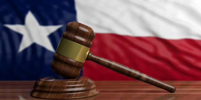 judge-or-auction-gavel-on-texas-us-of-america-waving-flag-background-3d-illustration
