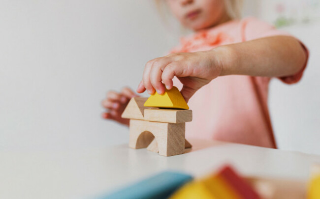 little-child-girl-playing-building-blocks-at-home-or-kindergarten-kid-play-room