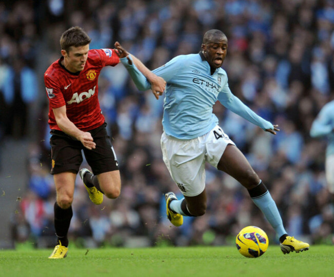manchester-citys-yaya-toure-right-and-manchester-uniteds-michael-carrick-left-battle-for-the-ball-during-their-premier-league-soccer-match-at-the-etihad-stadium-in-manchester-england-sunday-de