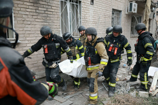 rescue-workers-carry-a-body-after-pulling-from-the-rubble-of-a-residential-building-destroyed-by-a-russian-airstrike-in-zaporizhzhia-ukraine-saturday-oct-10-2026-ap-photokateryna-klochko