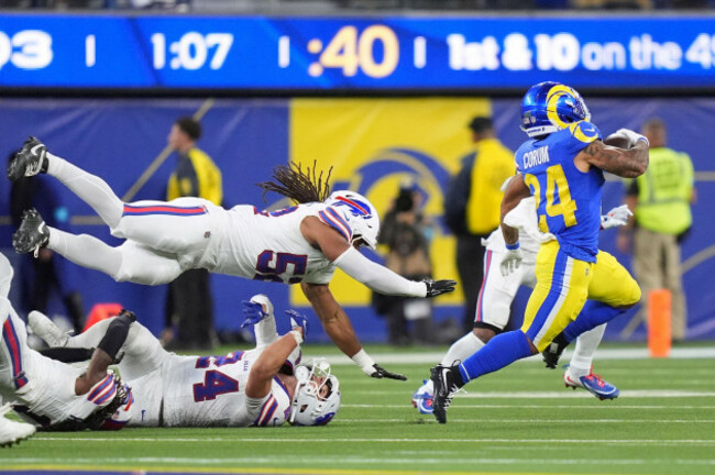 los-angeles-rams-running-back-blake-corum-right-runs-the-ball-as-buffalo-bills-defensive-end-michael-hoecht-upper-left-and-safety-cole-bishop-try-to-tackle-him-during-the-second-half-of-an-nfl-foo