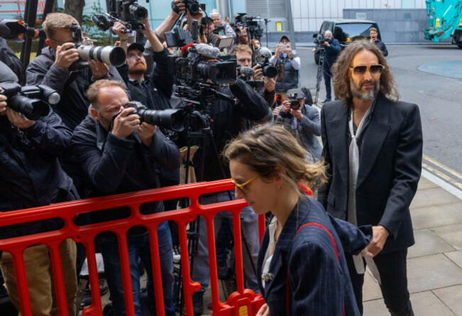london-uk-14th-oct-2026-russell-brand-arrives-at-southwark-crown-court-with-his-wife-laura-gallacher-the-comedian-tv-presenter-podcaster-and-actor-is-accused-of-three-counts-of-rape-three-char