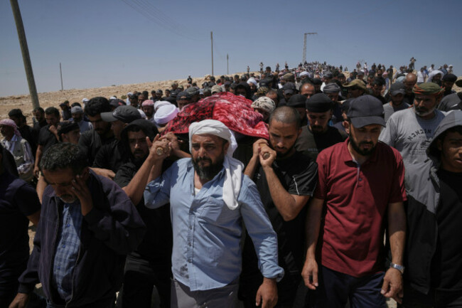 file-mourners-carry-the-body-of-palestinian-activist-awdah-hathaleen-during-his-funeral-in-the-west-bank-bedouin-village-of-umm-al-khair-aug-7-2025-ap-photomahmoud-illean-file