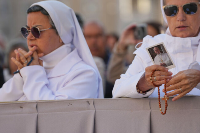 a-nun-holds-a-picture-of-pope-leo-xiv-prior-to-the-start-of-a-mass-to-conclude-the-vatican-meeting-of-the-heads-of-eastern-catholic-churches-and-presidents-of-bishops-conferences-titled-ten-years-af
